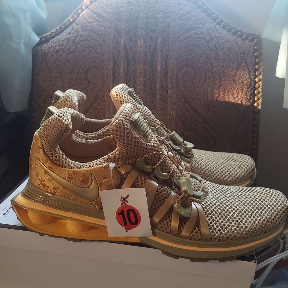 Gold Nike sport shoes